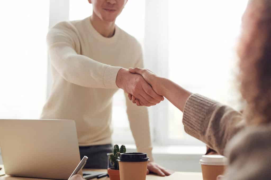 Two people shaking hands after a successful job interview